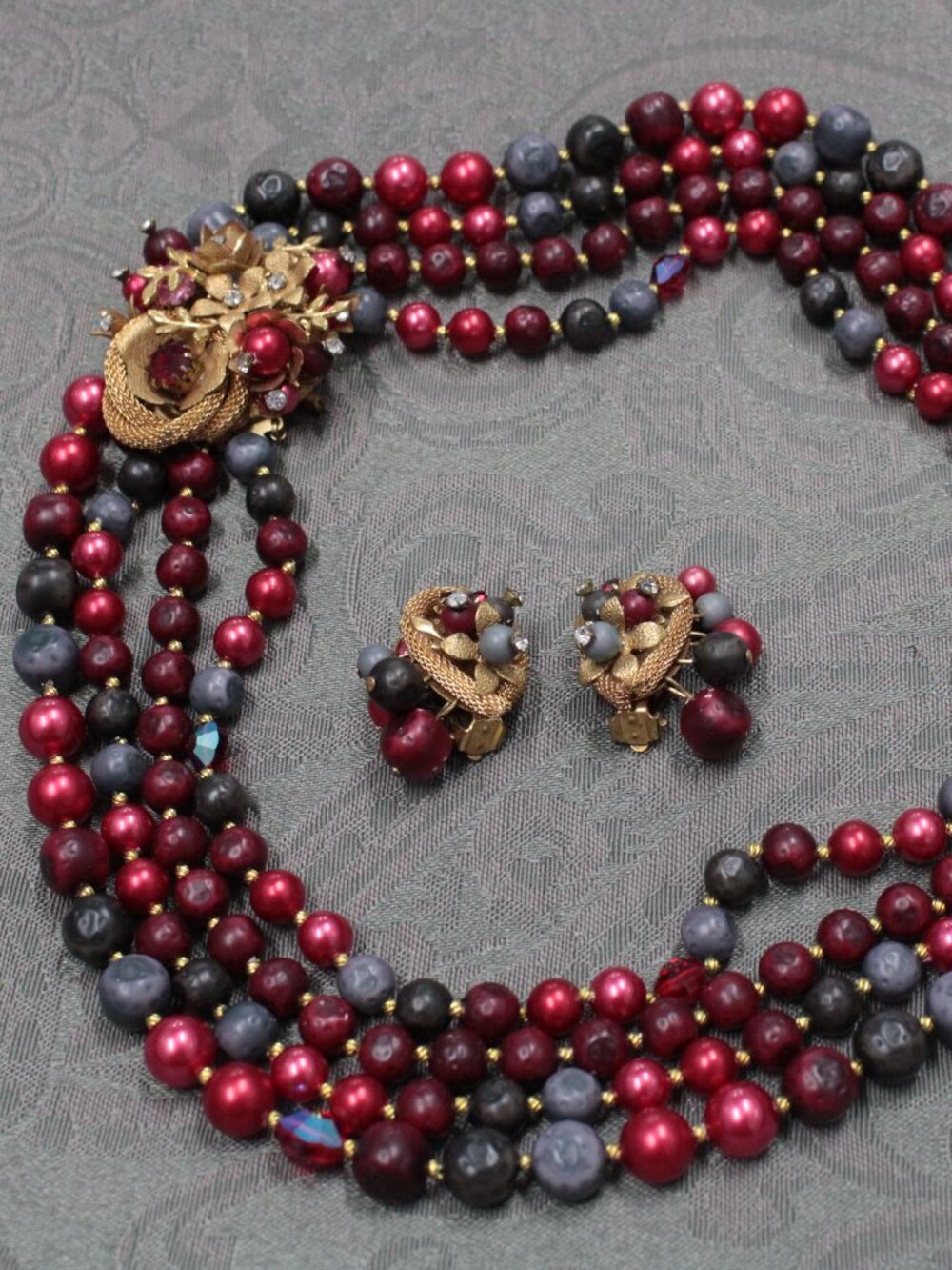 Vintage red and grey multistrand beaded necklace and clip-on earrings
